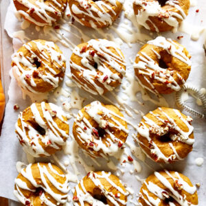 Baked Pumpkin Doughnuts with Maple Cream Cheese. - harvestandnourish.com